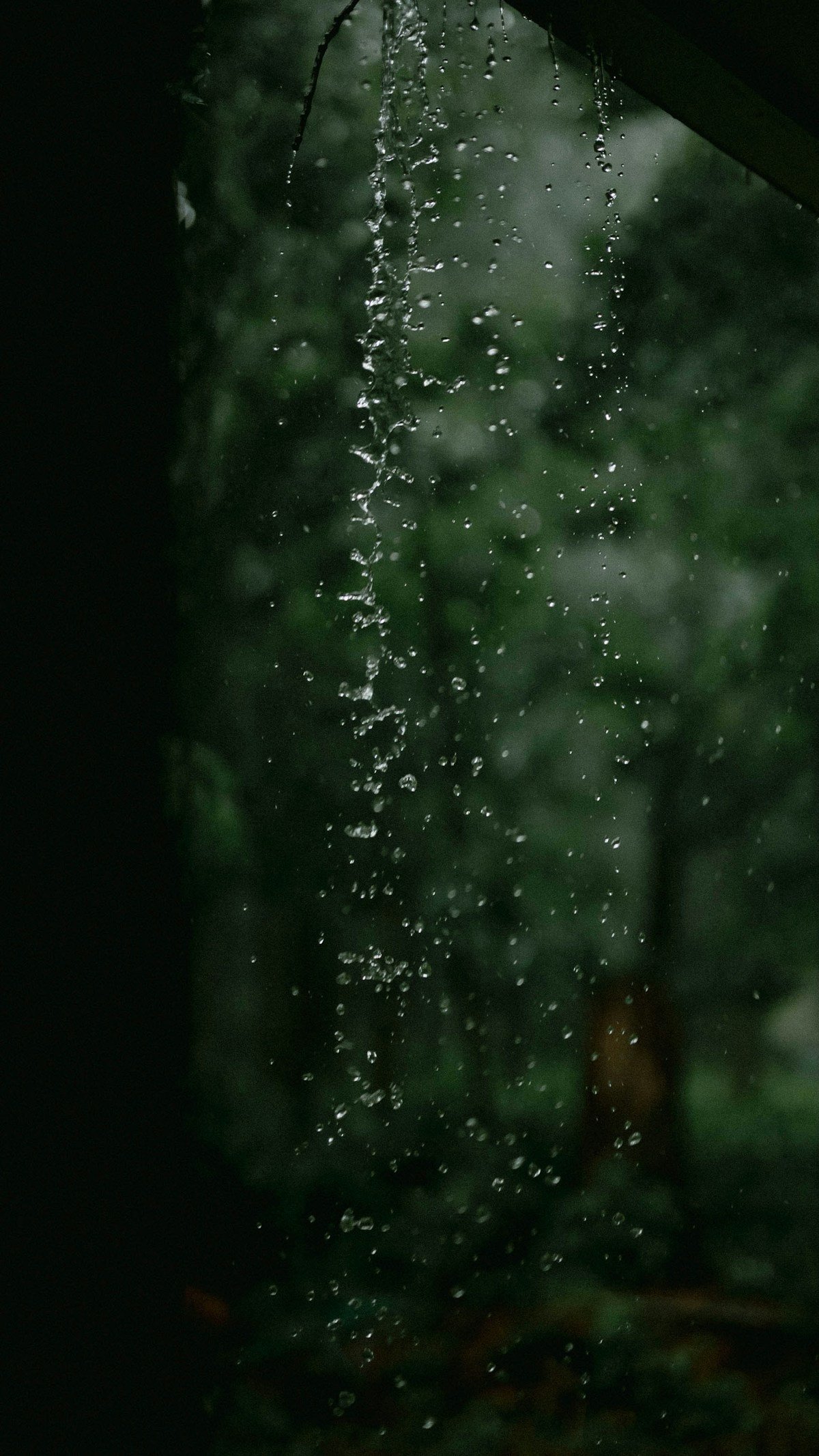 Rain falling from the roof of a residential property